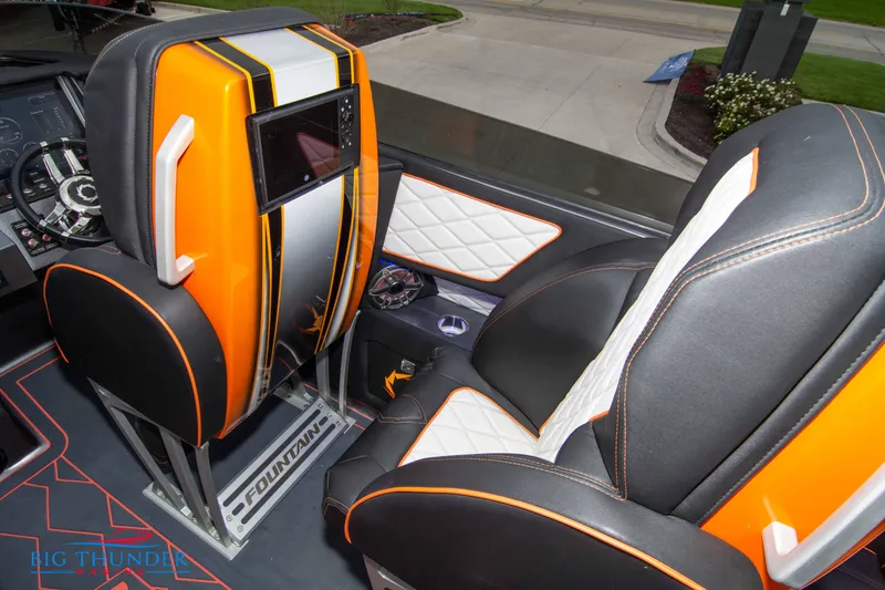 Slide: The Image of 2020 Fountain 47 Lightning interior with orange and black seats, modern dashboard, and sleek design. - 35