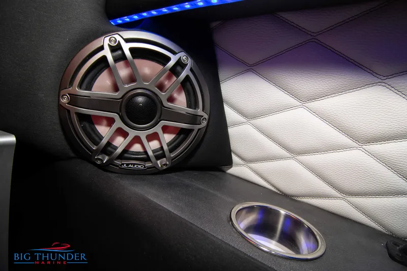 Slide: The Image of Speaker and cup holder in 2020 Fountain 47 Lightning boat interior. - 36