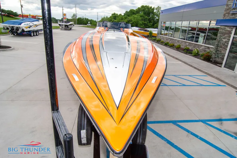 Slide: The Image of 2020 Fountain 47 Lightning boat with vibrant orange and black design at Big Thunder Marine. - 4