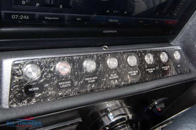 Slide: The Image of Control panel of a 2020 Fountain 47 Lightning boat with various switches. - 43