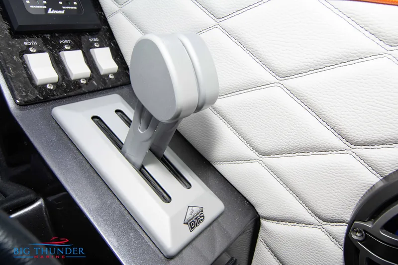 Slide: The Image of Close-up of 2020 Fountain 47 Lightning boat throttle control on quilted panel. - 47