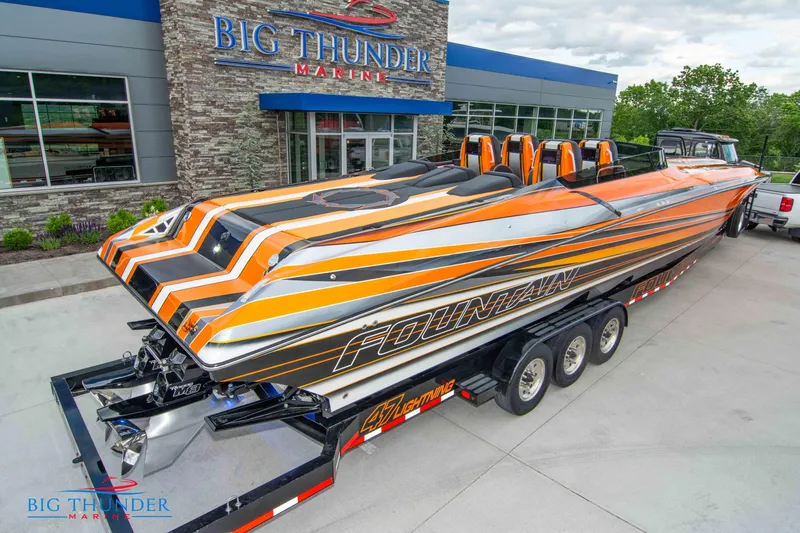 Slide: The Image of 2020 Fountain 47 Lightning speedboat with vibrant orange and black design at Big Thunder Marine. - 6