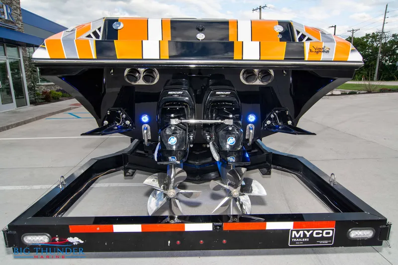 Slide: The Image of 2020 Fountain 47 Lightning boat on trailer, showcasing dual engines and vibrant orange-black design. - 7