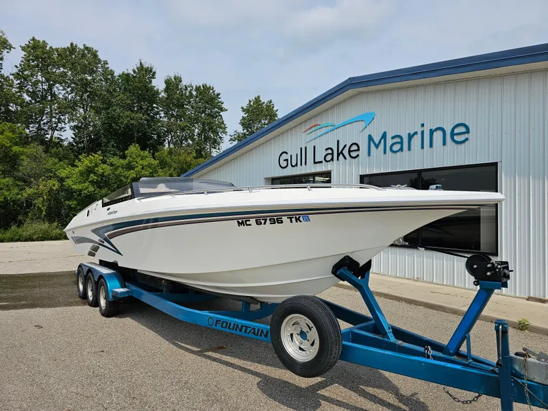 Slide: The Image of 1999 Fountain 29 Fever boat on trailer at Gull Lake Marine dealership. - 0