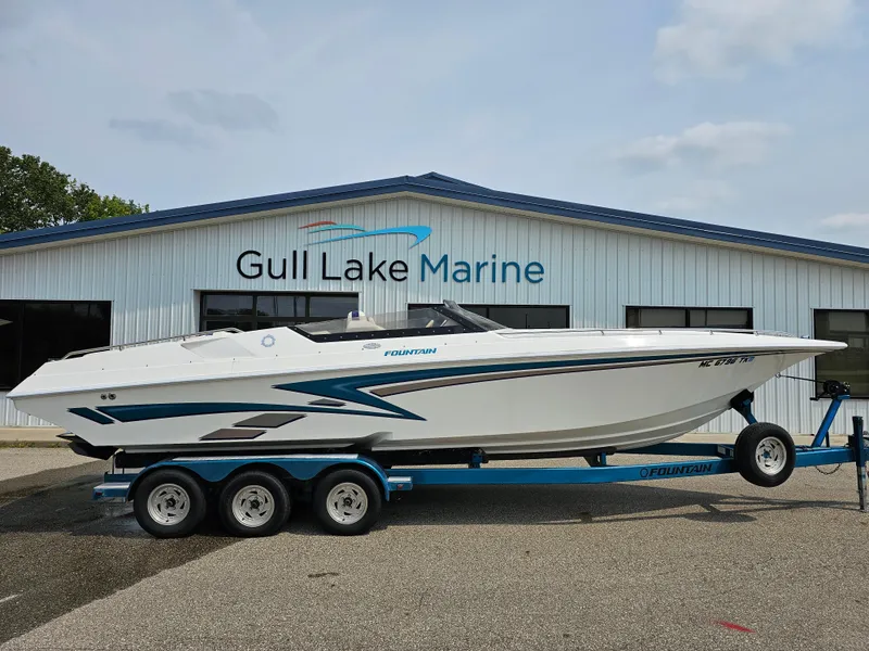 Slide: The Image of 1999 Fountain 29 Fever boat on trailer at Gull Lake Marine dealership. - 1