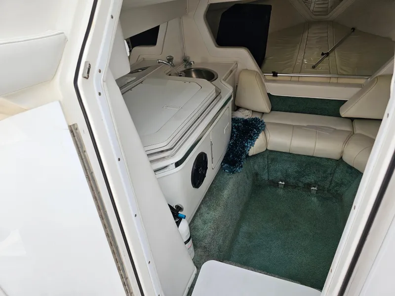 Slide: The Image of Interior of 1999 Fountain 29 Fever boat with seating and kitchenette. - 13