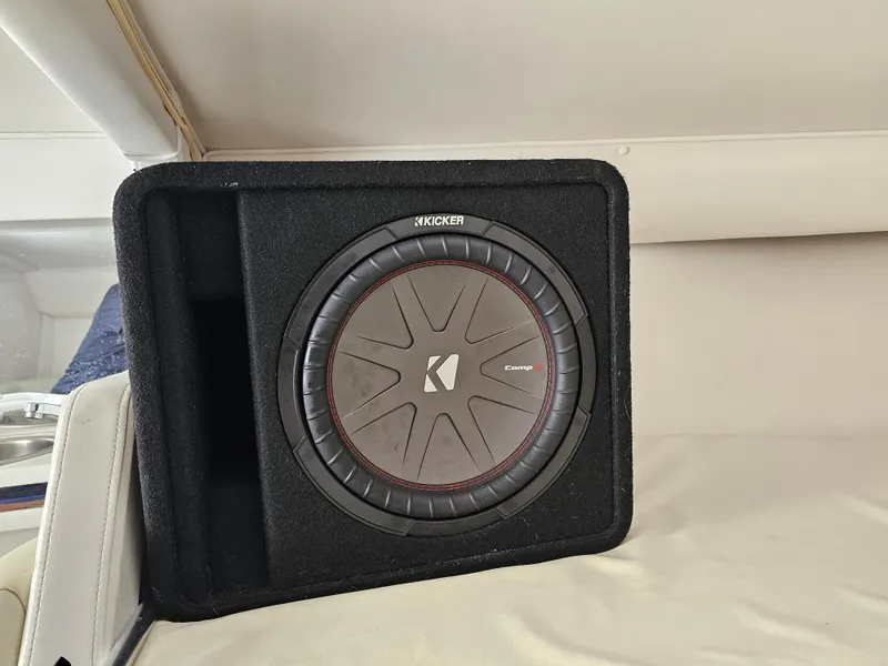 Slide: The Image of Kicker subwoofer in a 1999 Fountain 29 Fever boat interior. - 16