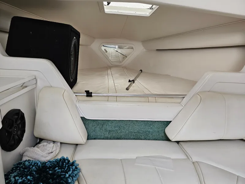 Slide: The Image of Interior of 1999 Fountain 29 Fever boat with white seating and speaker system. - 20