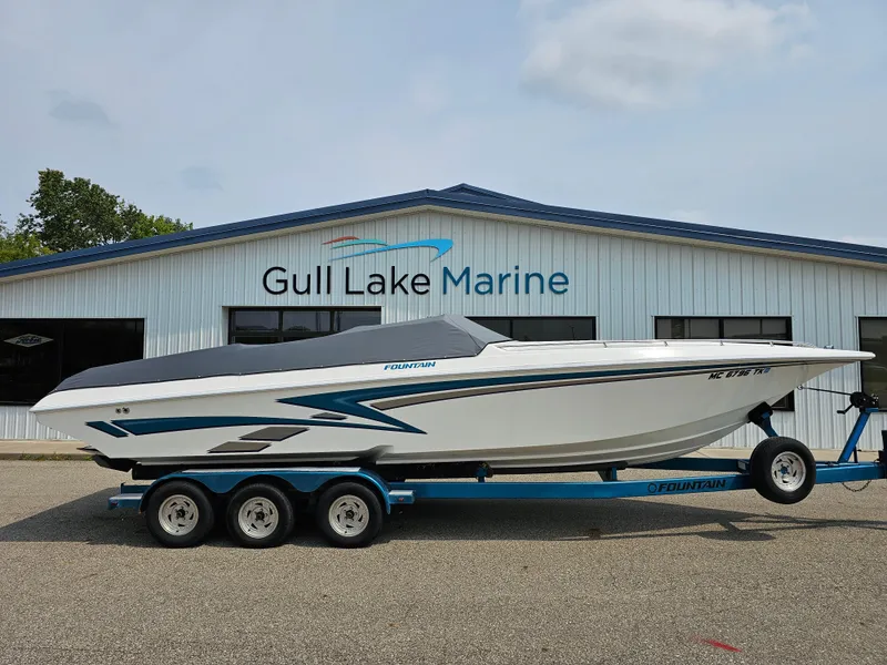 Slide: The Image of 1999 Fountain 29 Fever boat on trailer at Gull Lake Marine dealership. - 4