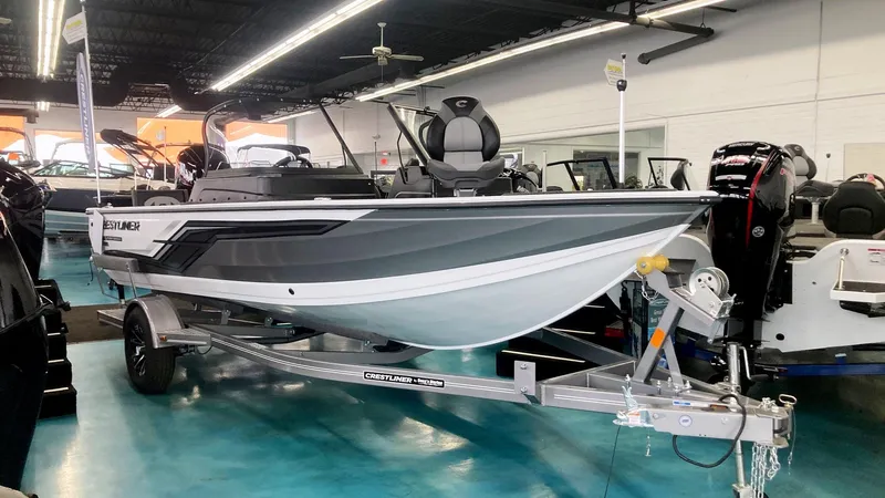 The Image of 2025 Crestliner 1850 Fish Hawk WT JS boat displayed in showroom on trailer. - 0