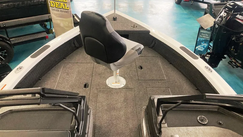 Slide: The Image of 2025 Crestliner 1850 Fish Hawk WT JS boat interior with swivel seat and carpeted deck. - 8