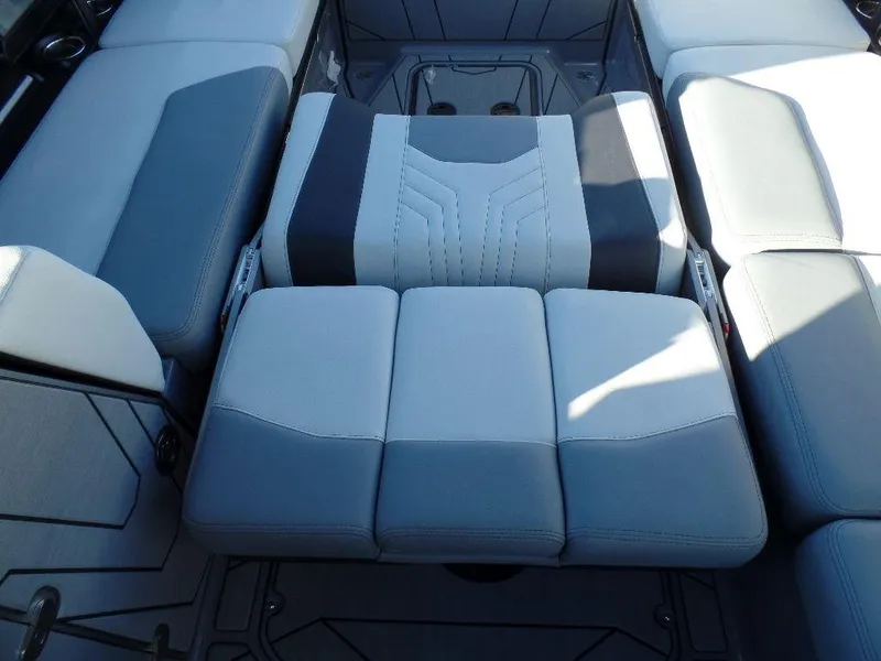 Slide: The Image of 2025 Malibu 25 LSV boat interior with gray and black seating arrangement. - 10