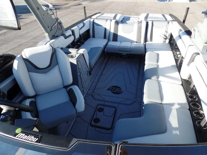 Slide: The Image of 2025 Malibu 25 LSV boat interior with spacious seating and modern design. - 19