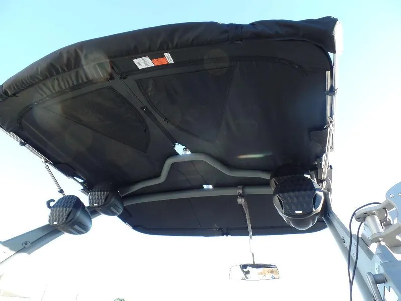 Slide: The Image of 2025 Malibu 25 LSV boat canopy with speakers and mirror, viewed from below. - 21