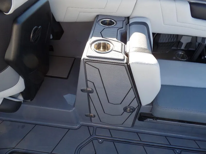 Slide: The Image of Interior of 2025 Malibu 25 LSV boat with cup holders and seating. - 8