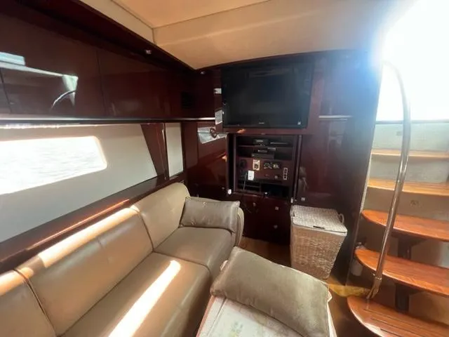 Slide: The Image of Luxurious interior of 2012 Sea Ray 500 Sundancer yacht with leather seating and entertainment system. - 16