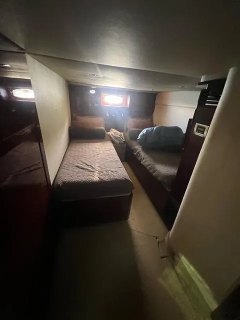 Slide: The Image of Interior cabin of 2012 Sea Ray 500 Sundancer with twin beds and window. - 22