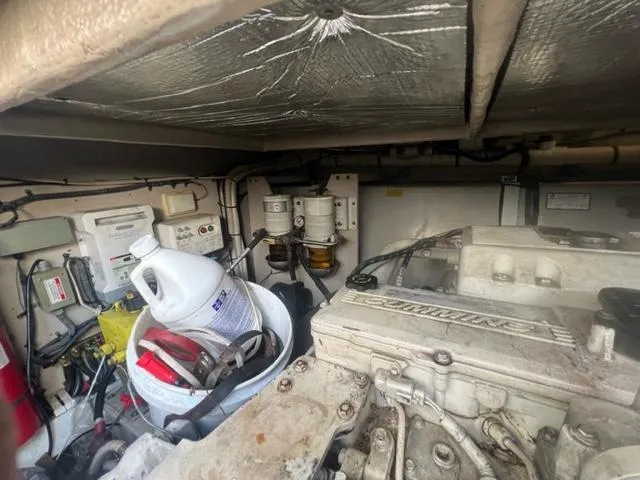 Slide: The Image of Engine room of 2012 Sea Ray 500 Sundancer with maintenance supplies and equipment. - 27