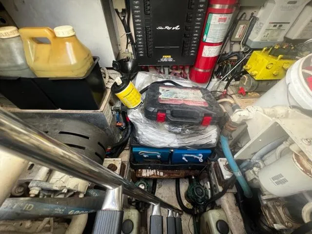 Slide: The Image of Engine room of 2012 Sea Ray 500 Sundancer with tools and equipment. - 29