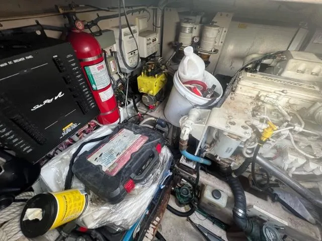 Slide: The Image of Engine room of 2012 Sea Ray 500 Sundancer with equipment and fire extinguisher. - 30