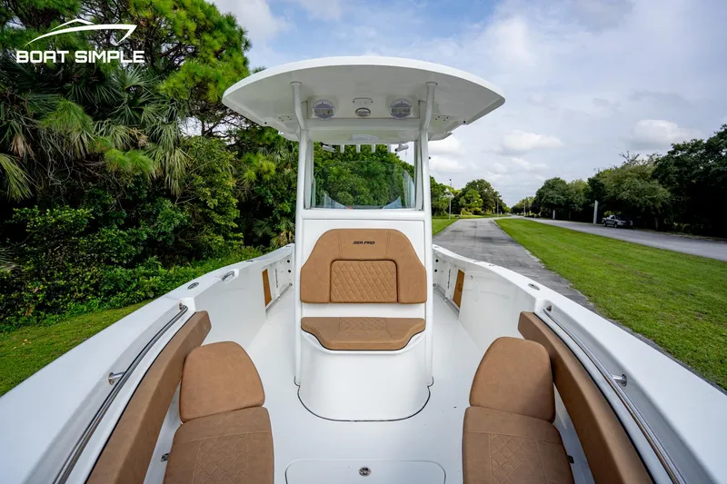 Slide: The Image of 2024 Sea Pro 239 Deep V CC boat with spacious seating and sleek design. - 6