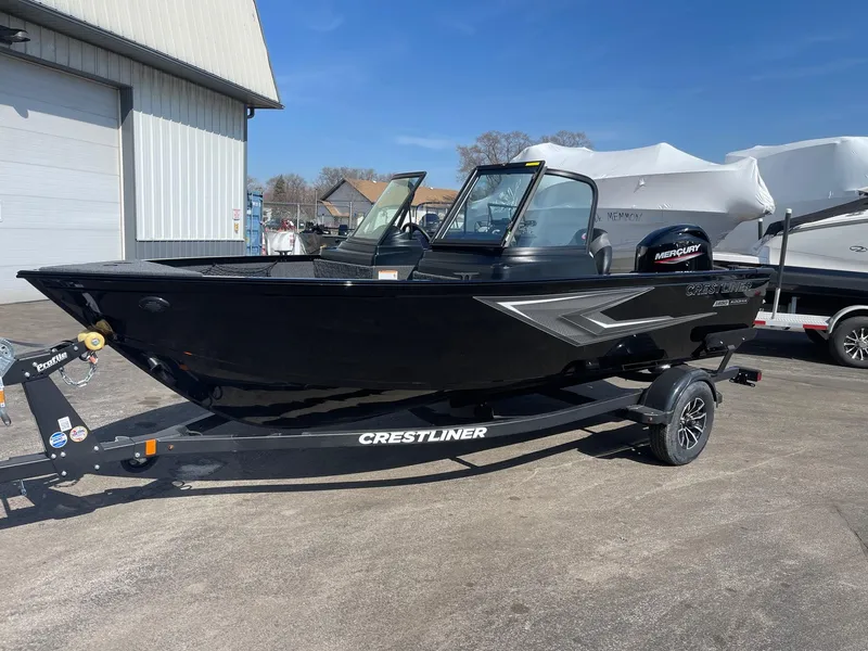 The Image of 2025 Crestliner 1650 KODIAK WT boat on trailer, parked outdoors. - 0