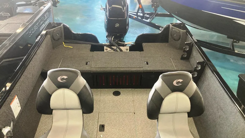 Slide: The Image of 2025 Crestliner 1650 KODIAK WT boat interior with two seats and motor. - 4