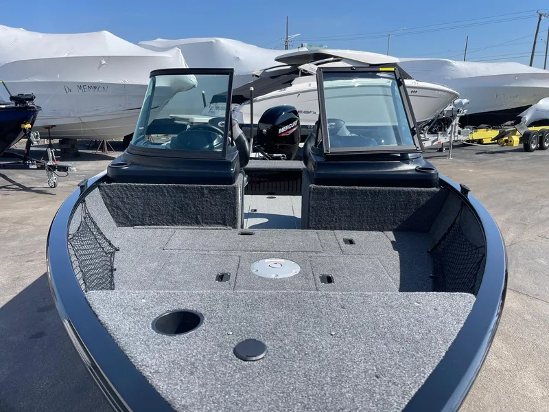 Slide: The Image of 2025 Crestliner 1650 KODIAK WT fishing boat with open deck and windshield. - 6