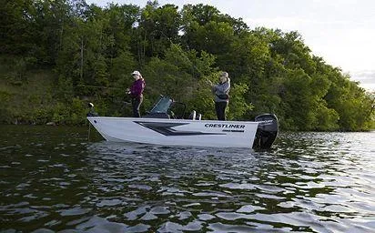 Slide: The Image of 2025 Crestliner 1650 KODIAK WT boat on a scenic lake with two people fishing. - 8
