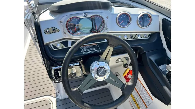 Slide: The Image of 2012 Sea-Doo 230 Challenger SE dashboard with steering wheel and gauges. - 10
