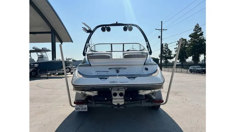 Slide: The Image of Rear view of 2012 Sea-Doo 230 Challenger SE boat in a parking area. - 4
