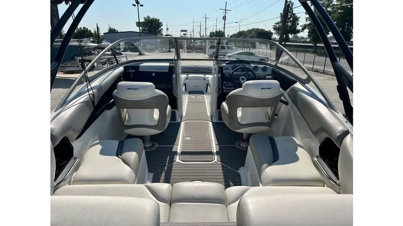 Slide: The Image of 2012 Sea-Doo 230 Challenger SE boat interior with seating and dashboard view. - 5