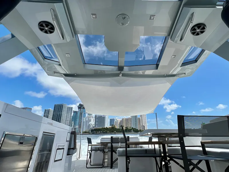 Slide: The Image of Luxurious 2021 OKEAN 55 Sport yacht interior with city skyline view. - 17