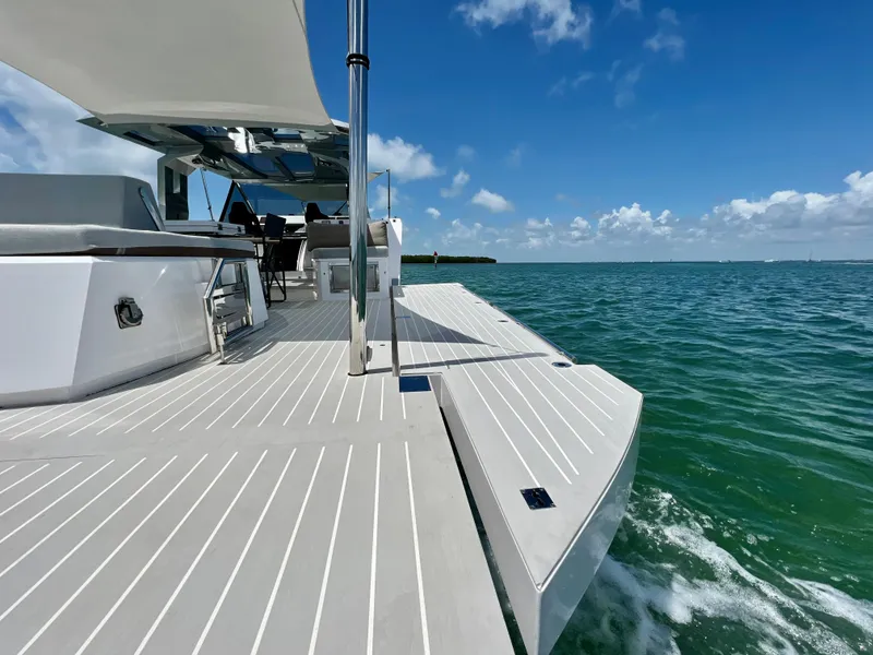 Slide: The Image of 2021 OKEAN 55 Sport yacht cruising on clear blue waters under a sunny sky. - 24