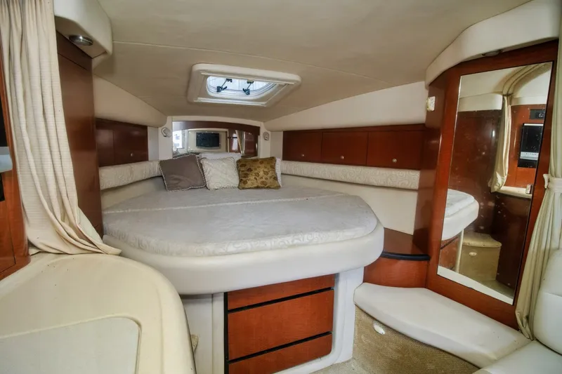 Slide: The Image of Interior cabin of 2005 Sea Ray 340 Sundancer yacht with bed and mirror. - 10