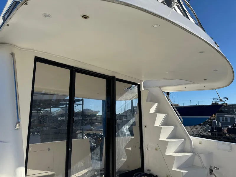 Slide: The Image of 2001 Sandpiper 50 yacht with sleek design and modern staircase. - 21