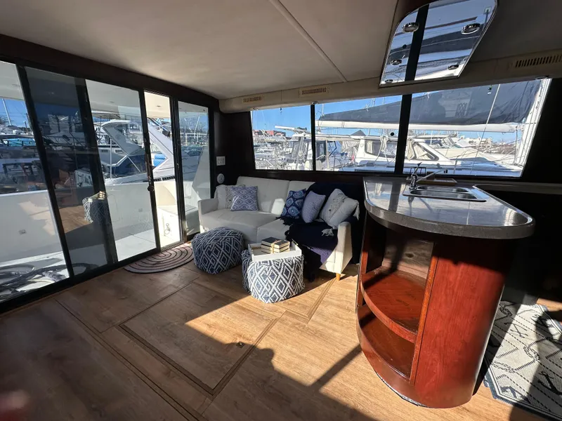 Slide: The Image of Interior of 2001 Sandpiper 50 yacht with modern seating and marina view. - 25