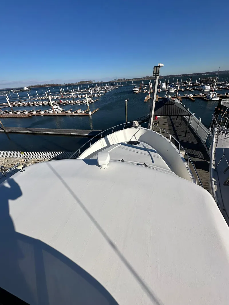 Slide: The Image of View from Sandpiper 50 yacht, overlooking marina with clear blue sky, 2001 model. - 30