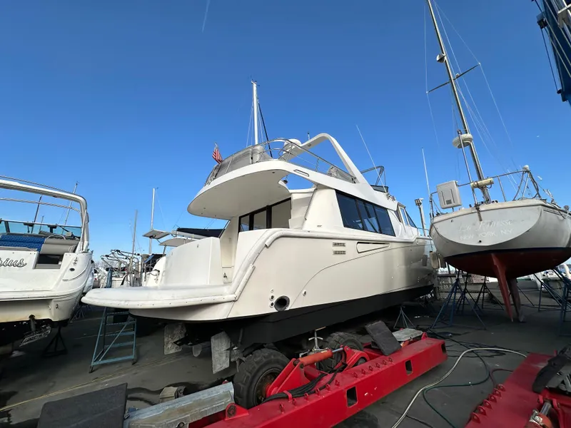 Slide: The Image of Sandpiper 50 yacht from 2001 on dry dock, surrounded by other boats. - 32