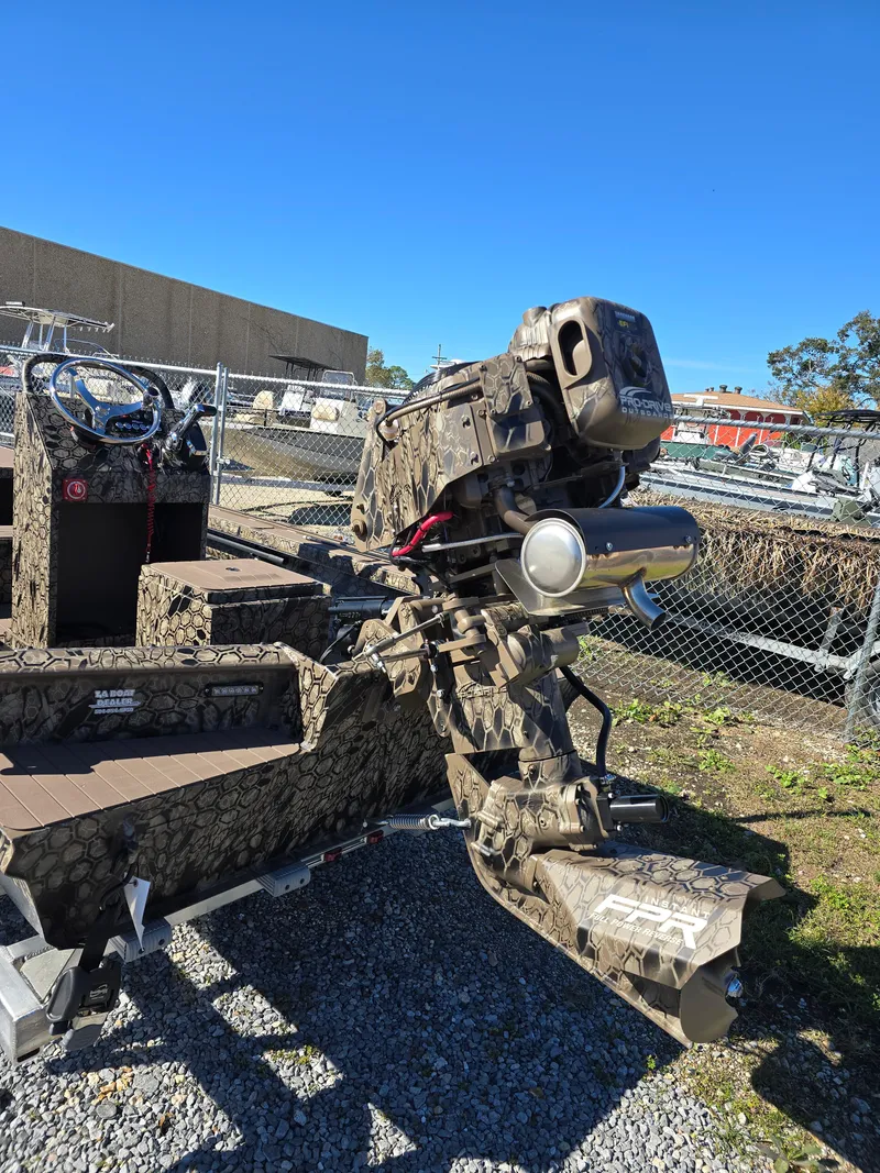 Slide: The Image of 2024 Pro-Drive X Series 1860 CC boat with camo design and powerful outboard motor. - 8