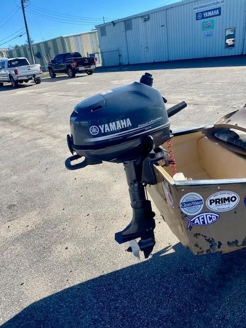 Slide: The Image of 1999 Gheenoe 13' boat with Yamaha outboard motor in parking lot. - 8