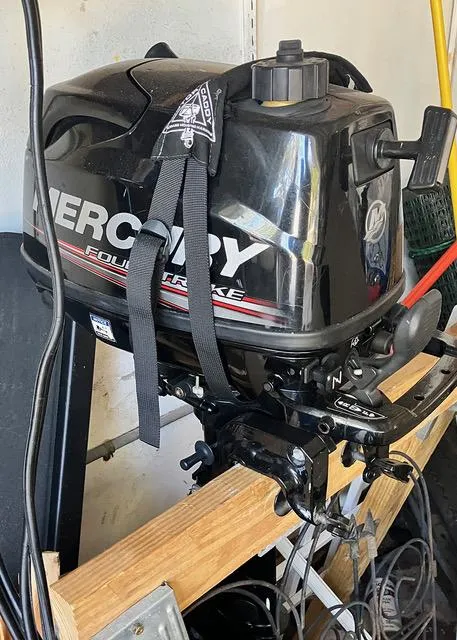 Slide: The Image of Mercury outboard motor on Beneteau 1990 Sloop, stored indoors. - 17