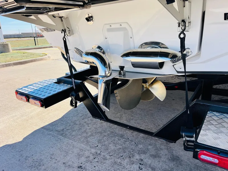 Slide: The Image of 2025 Nautique Super Air Nautique G25 Paragon boat propeller and exhaust detail. - 10