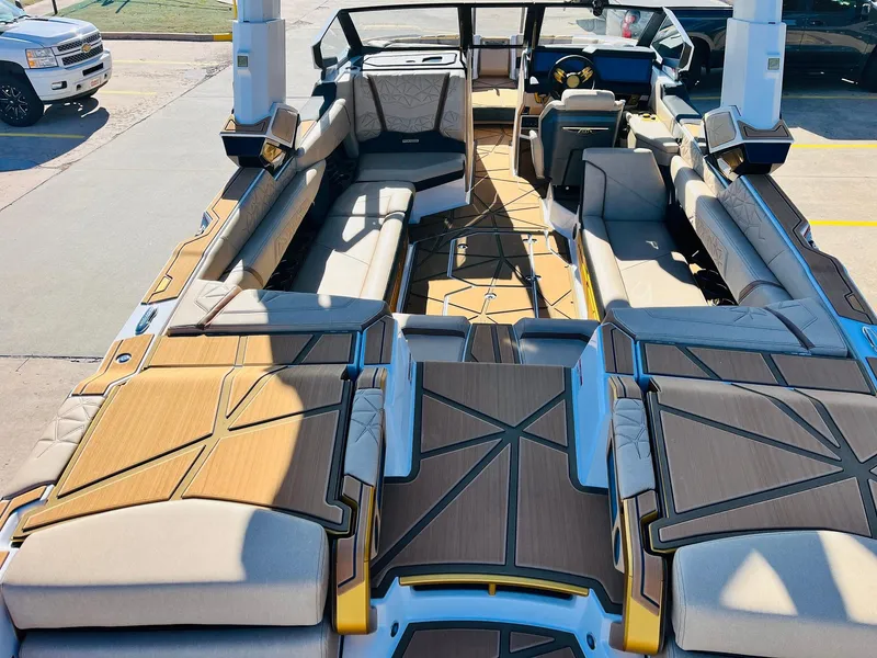 Slide: The Image of 2025 Nautique Super Air Nautique G25 Paragon interior with luxurious seating and modern design. - 12