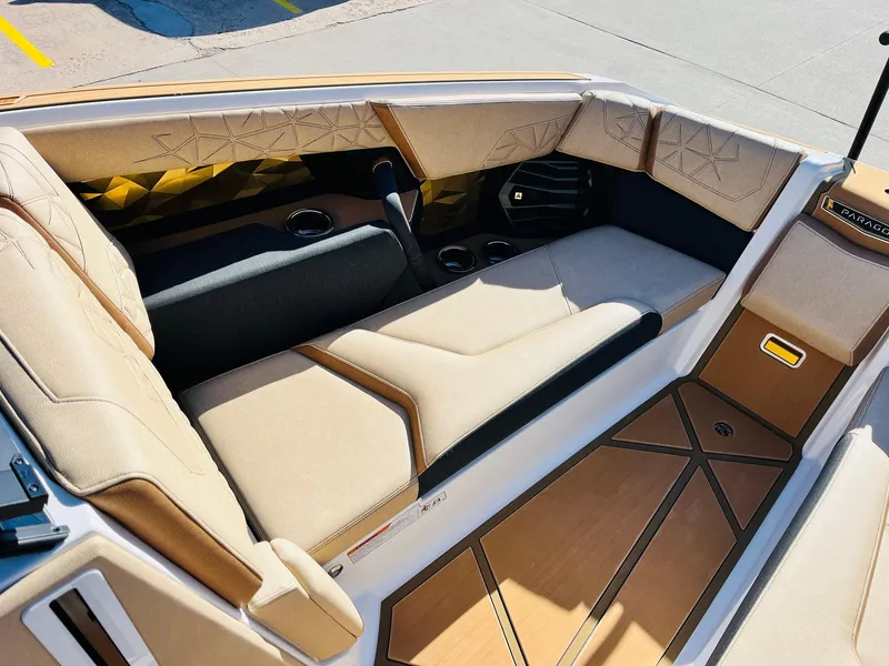 Slide: The Image of 2025 Nautique Super Air Nautique G25 Paragon interior with luxurious seating and modern design. - 19