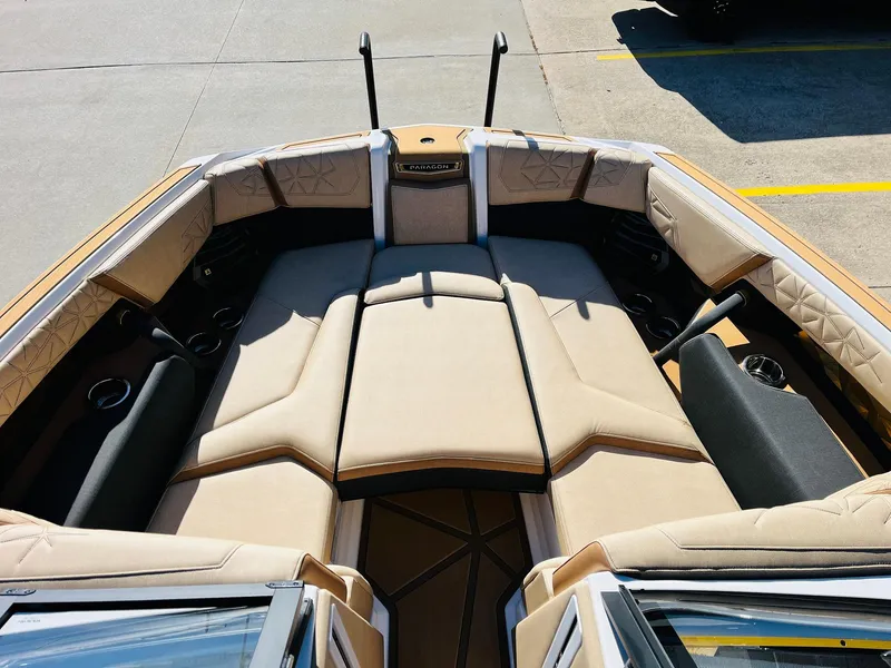Slide: The Image of 2025 Nautique Super Air Nautique G25 Paragon boat interior with beige seating. - 21