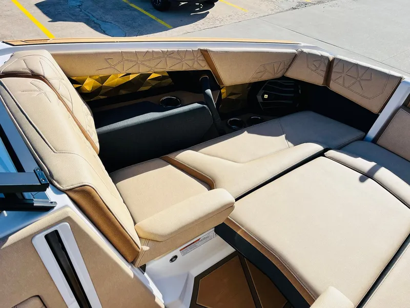 Slide: The Image of 2025 Nautique Super Air Nautique G25 Paragon interior with luxurious beige seating. - 22