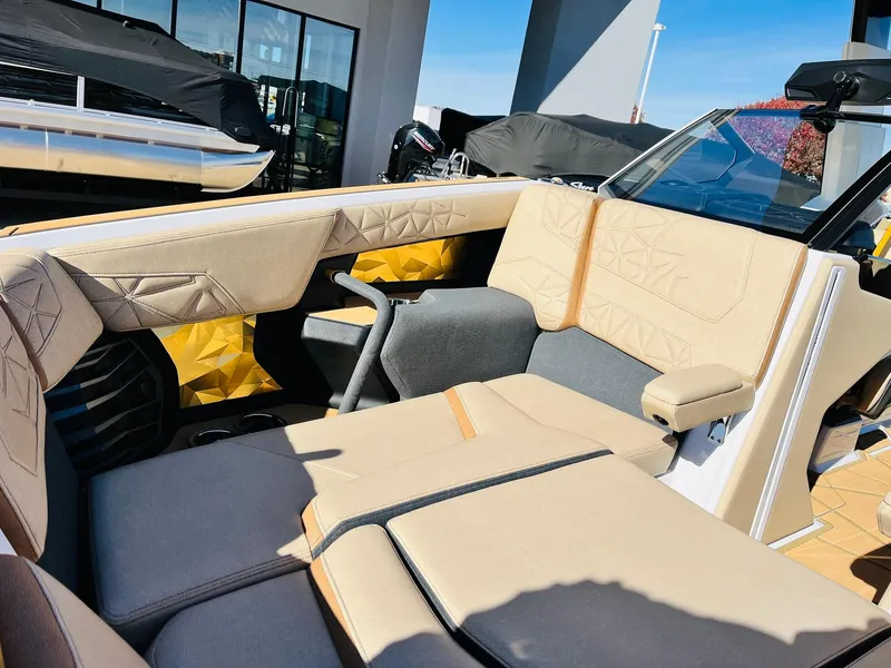 Slide: The Image of 2025 Nautique Super Air Nautique G25 Paragon interior with luxurious beige seating. - 25