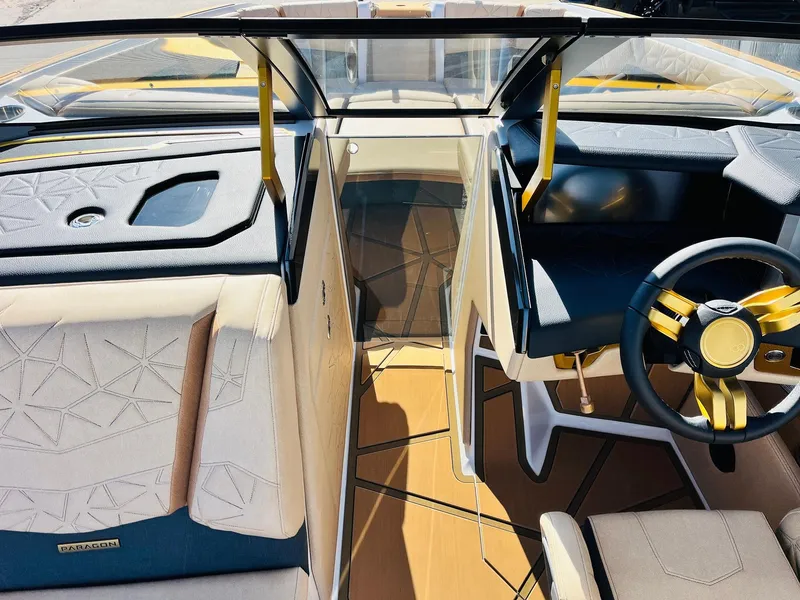 Slide: The Image of Interior of 2025 Nautique Super Air Nautique G25 Paragon boat, featuring luxurious seating and modern design. - 29