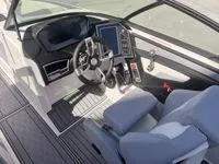 Slide: The Image of 2024 MasterCraft XT25 boat interior with modern dashboard and steering wheel. - 10